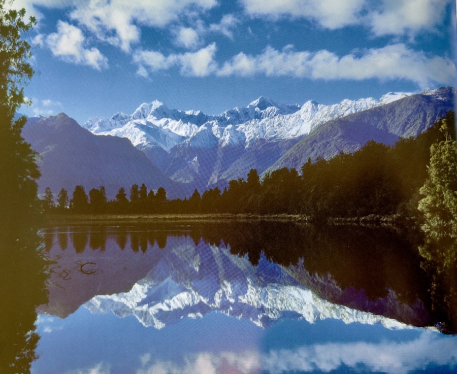 Mountain lake retreat with snowy peaks